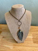 Load image into Gallery viewer, Gray Leather Feather 30&quot; Necklace with stamped Idaho charm and bead.